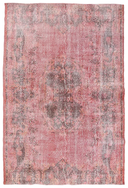 Full overhead view of the vintage rose and charcoal medallion rug
