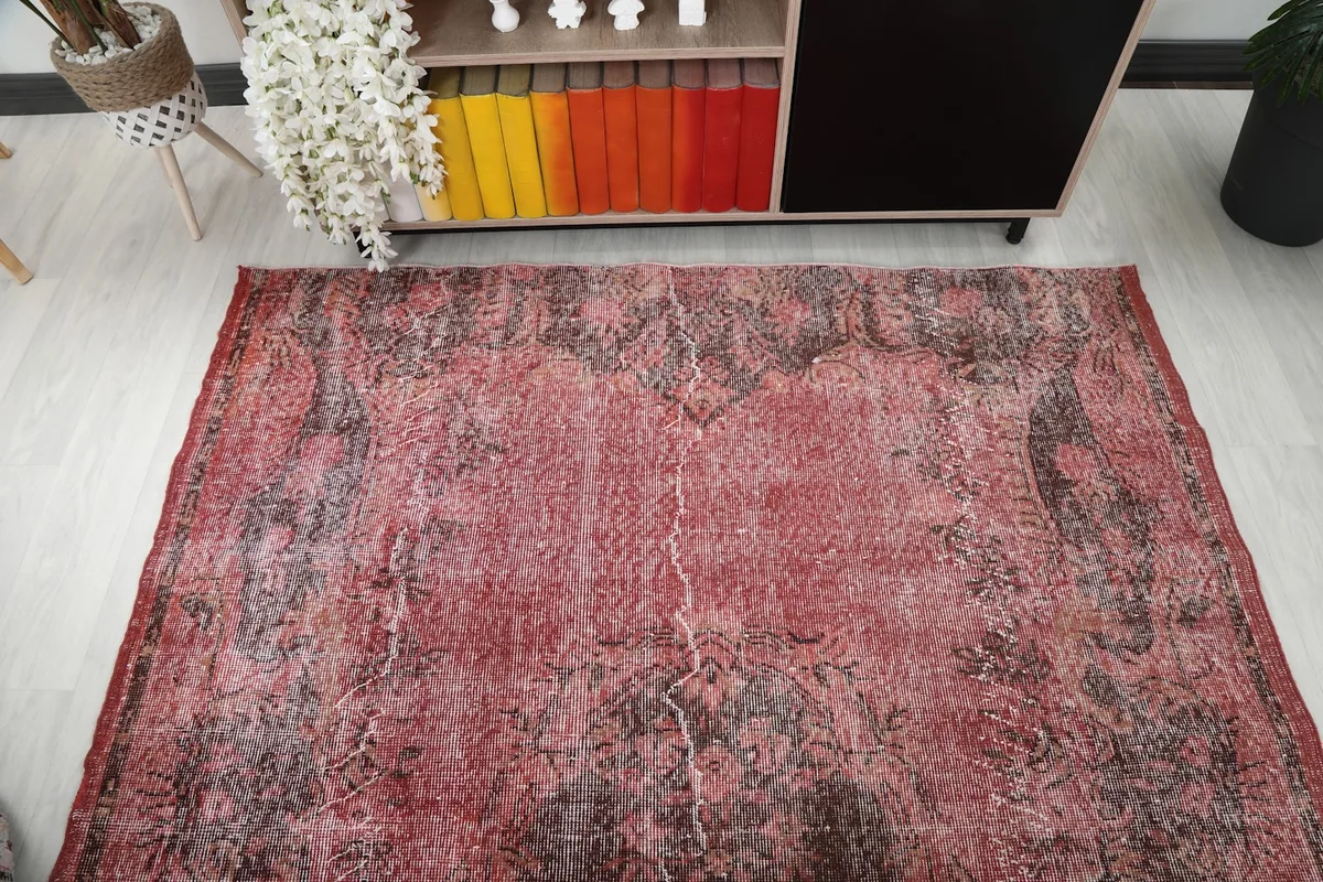 Overhead shot of the rug placed in a room with furniture