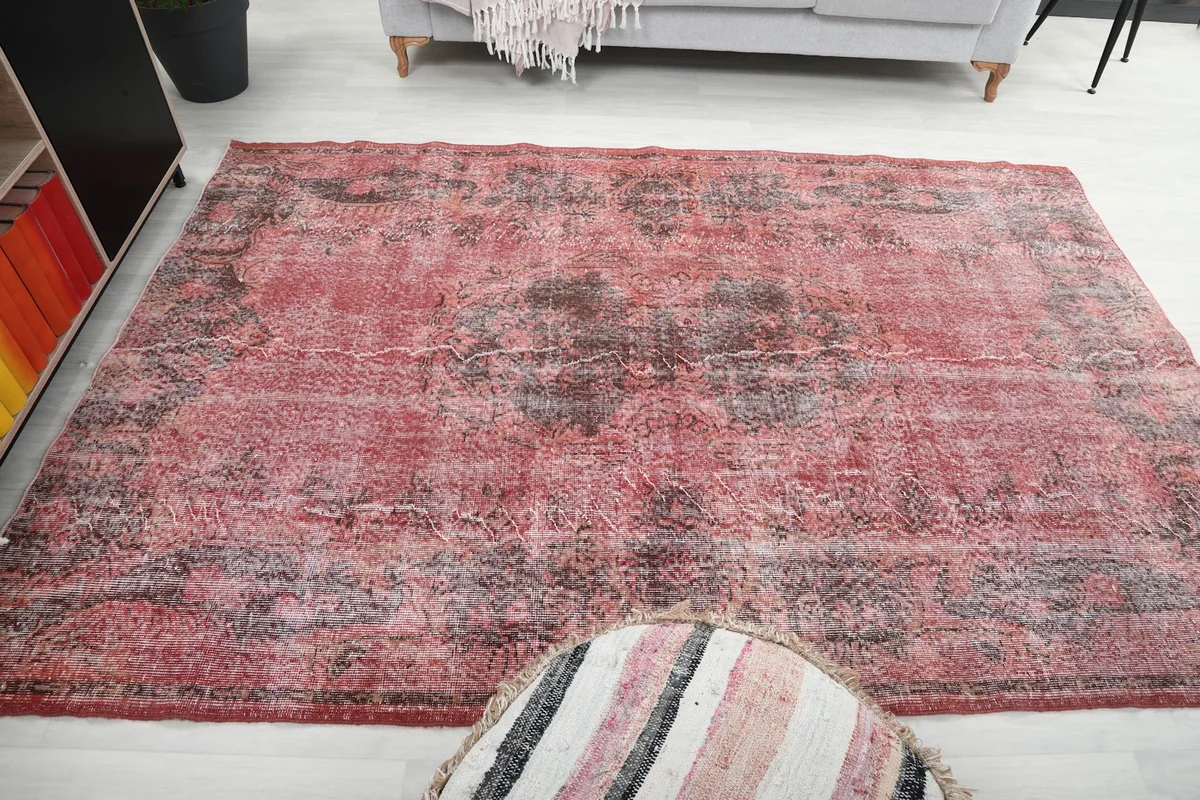 Top-down view of the rug's full pattern and condition in a room