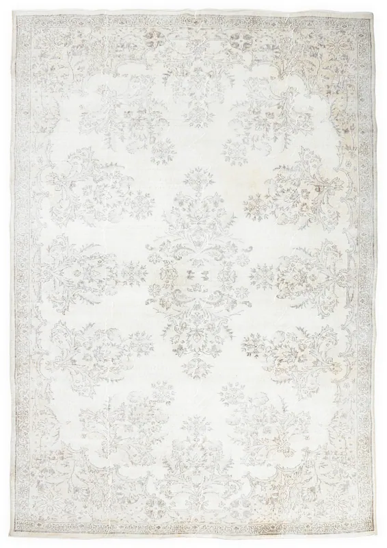 Full top view of the 7'2" x 10'4" ivory floral vintage Anatolian area rug