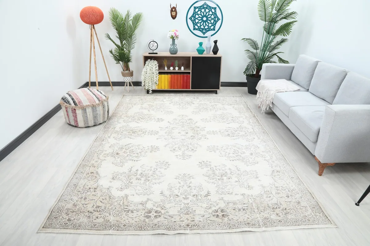 Ivory floral vintage Anatolian rug showcased in a modern living room setting