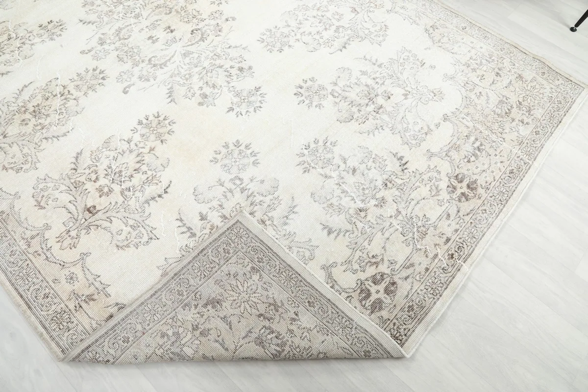 Corner of the rug folded back to show the construction and backside detail