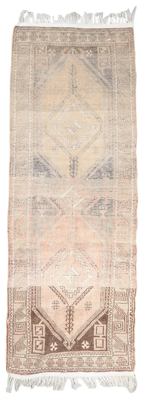 Full top view of the vintage Anatolian runner rug with beige, pink, and brown geometric patterns