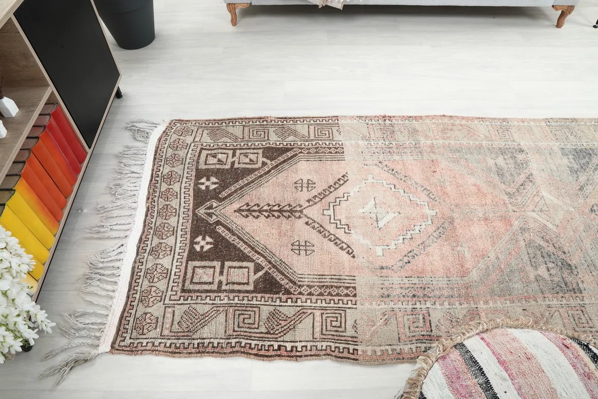 View of the runner rug stretching across a room floor, showing its full design