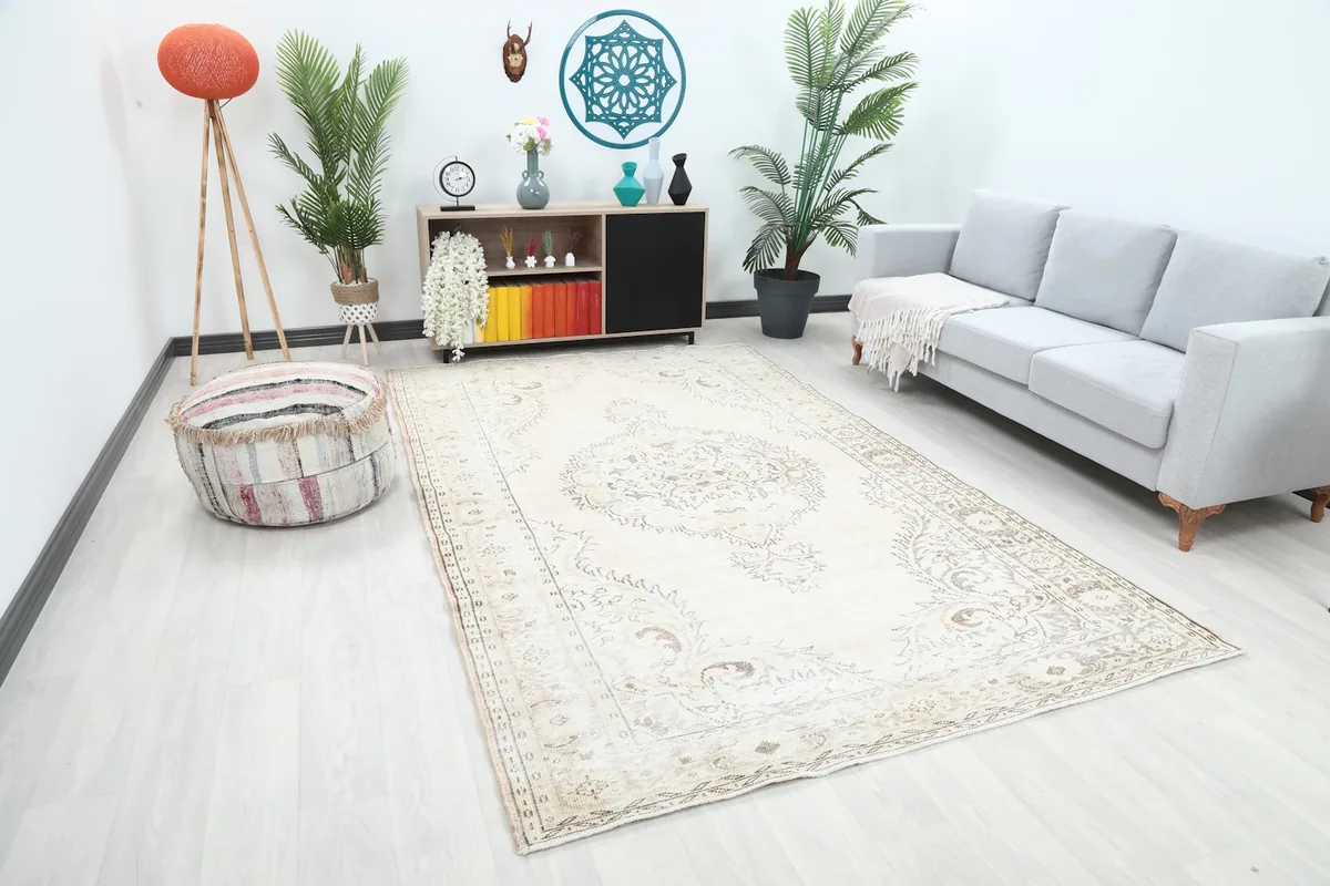 Angled view of the ivory and gray vintage rug placed in a modern living space