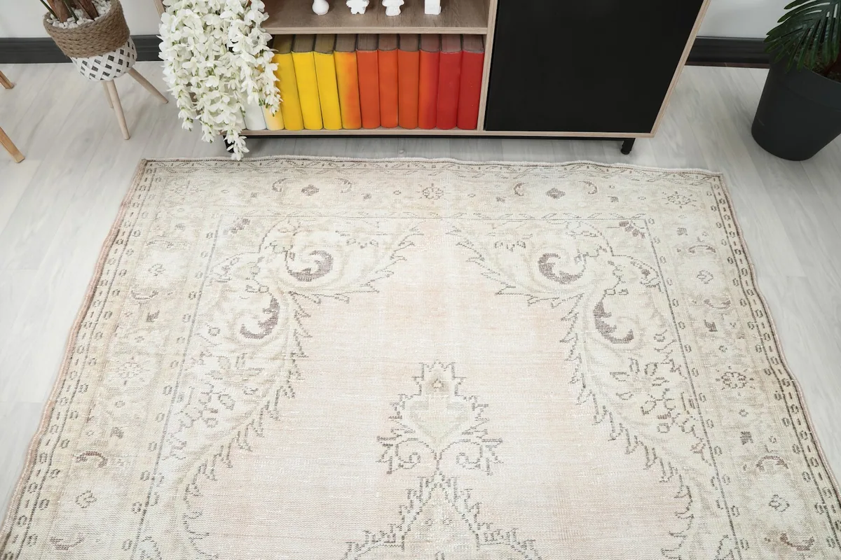 Overhead view showing a section of the rug, its medallion, and surrounding decor