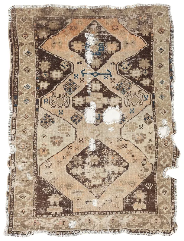 Full top view of the distressed brown and beige geometric vintage Anatolian rug on a white background.