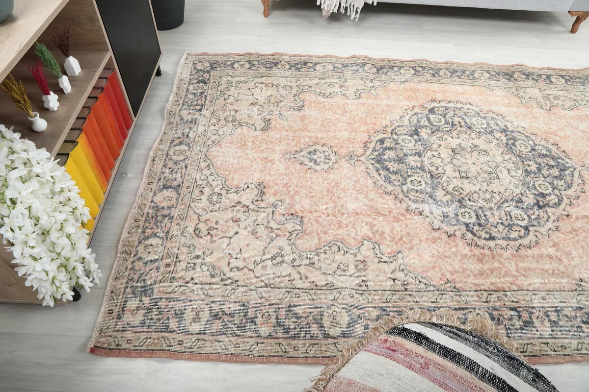 Wide angled view of the rug in a room, capturing its full presence and color palette.