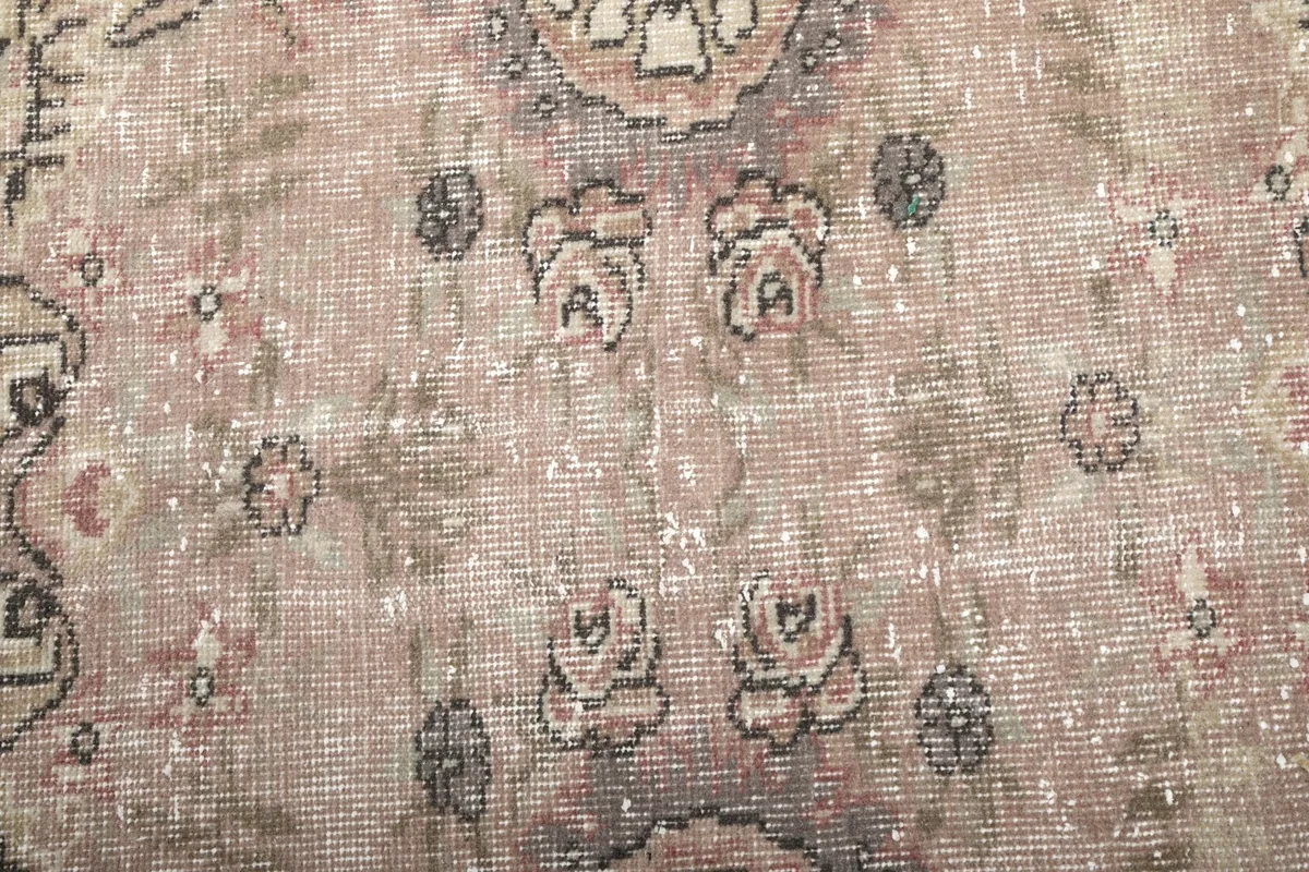 Detailed view of the rug's surface, showing individual knots and color variations