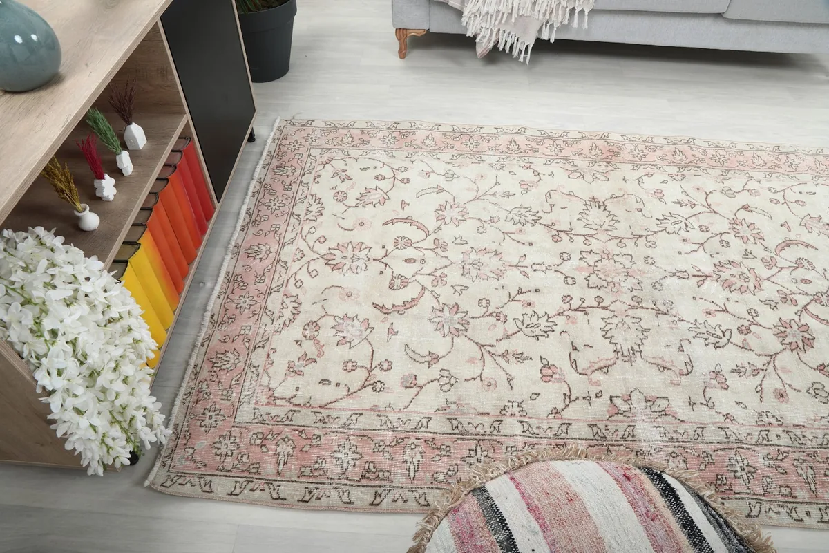 Longer view of the Cream Rose Floral Anatolian Rug in a home decor setting