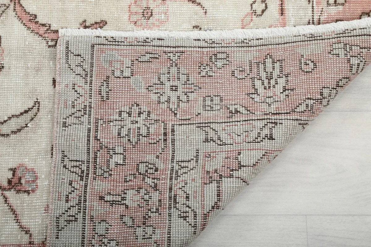 View of the back of the rug revealing the cotton foundation and knotting