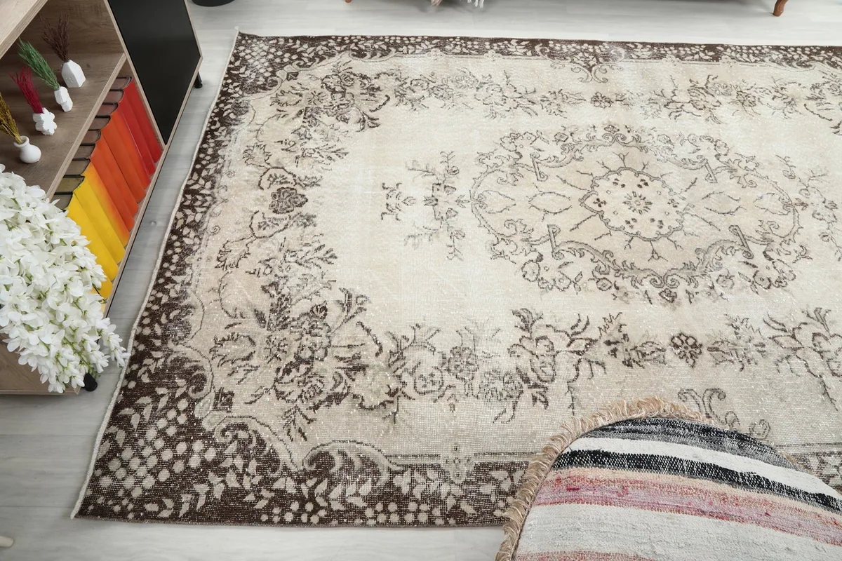 View of the rug from another angle, showing the border and field patterns