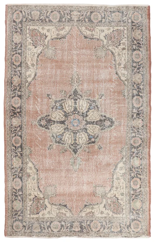 Full overhead view of the rust vintage Anatolian rug with medallion and floral patterns