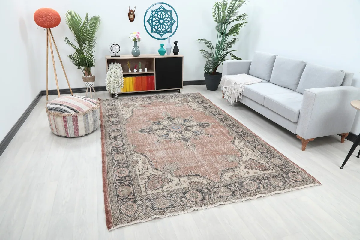 Angle view of the rust Anatolian rug in a room, highlighting its large size