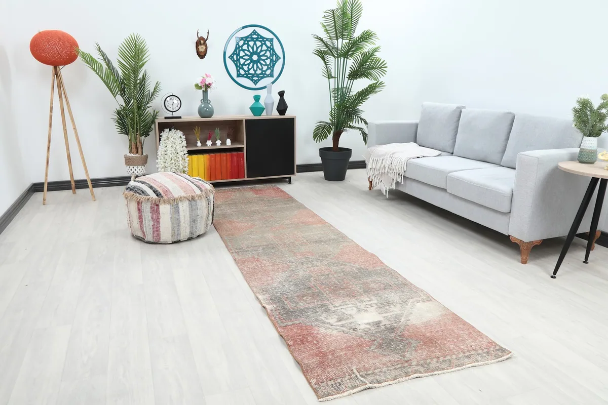 Long view of the rose and gray runner rug placed in a hallway setting