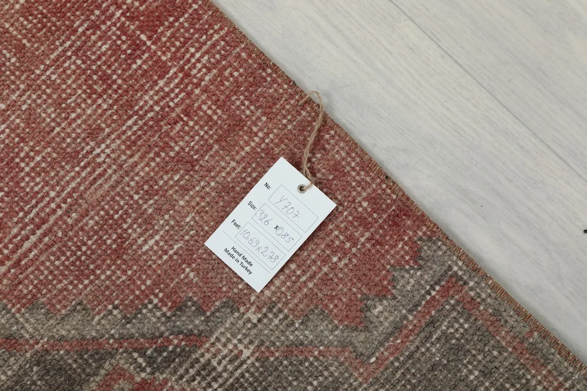 Close-up of the rug's label, indicating its origin and material