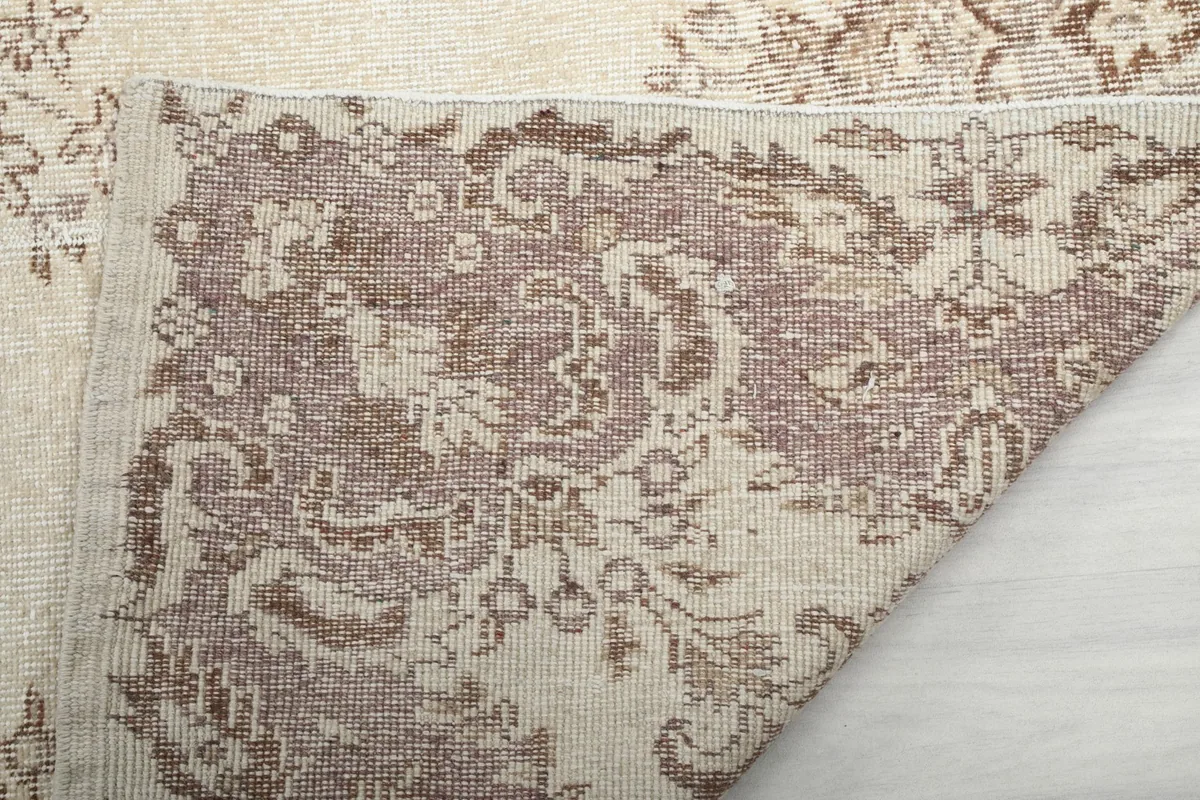 Underside view of the hand-knotted cotton foundation and wool pile