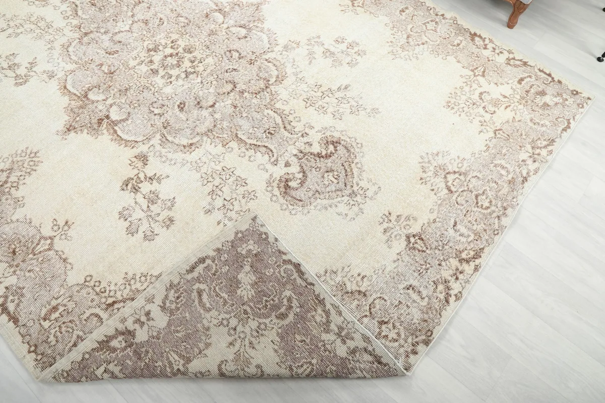 Folded corner of the rug to show the thickness and flexibility of the material