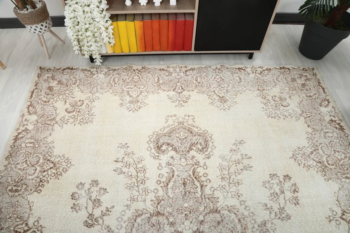Overhead view of the rug in a room, highlighting the full design