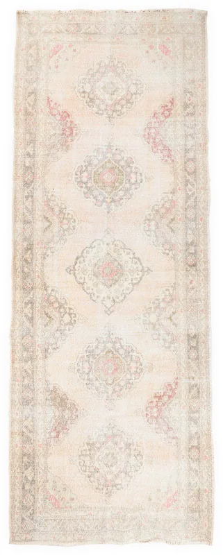 Full overhead view of the beige and rose vintage Anatolian runner rug