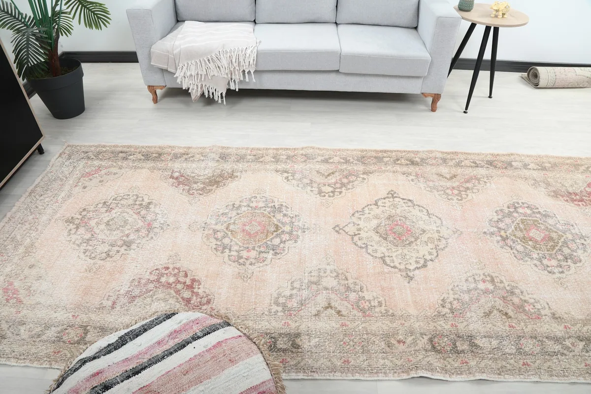 Side view of the runner rug laid out in a room, emphasizing its long, narrow shape
