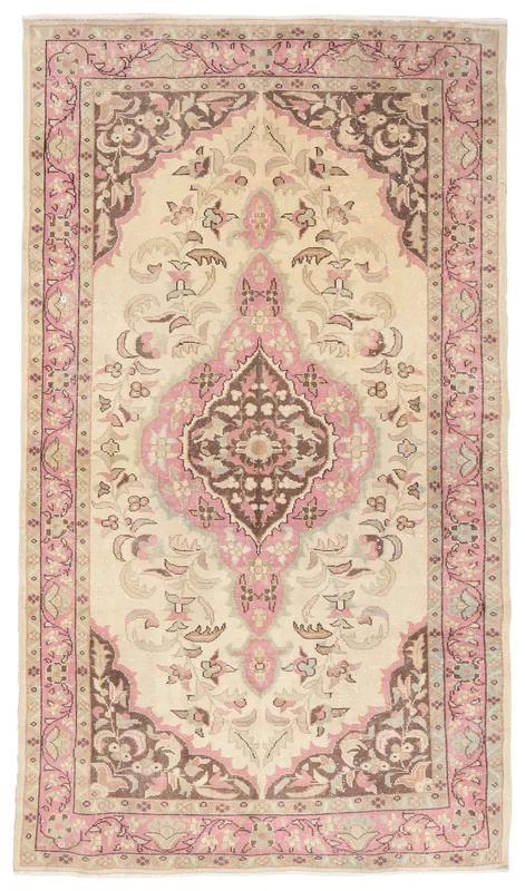 Full top view of the ivory, pink, and brown vintage Anatolian area rug
