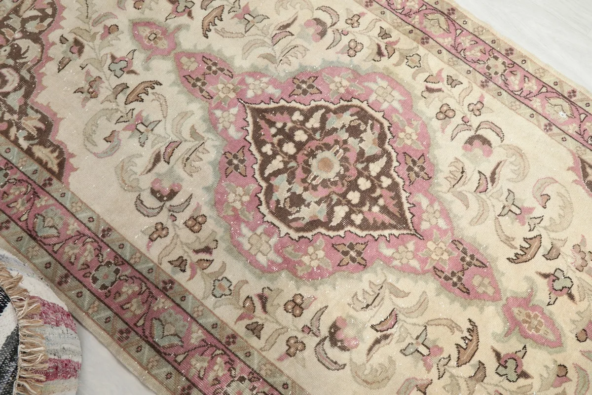 Overhead angle view of the rug's pattern and colors, including the medallion