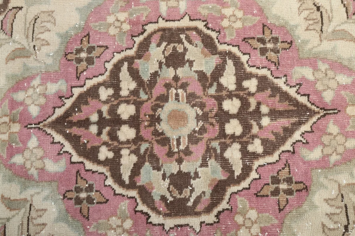 Close-up of the intricate central medallion and surrounding floral details