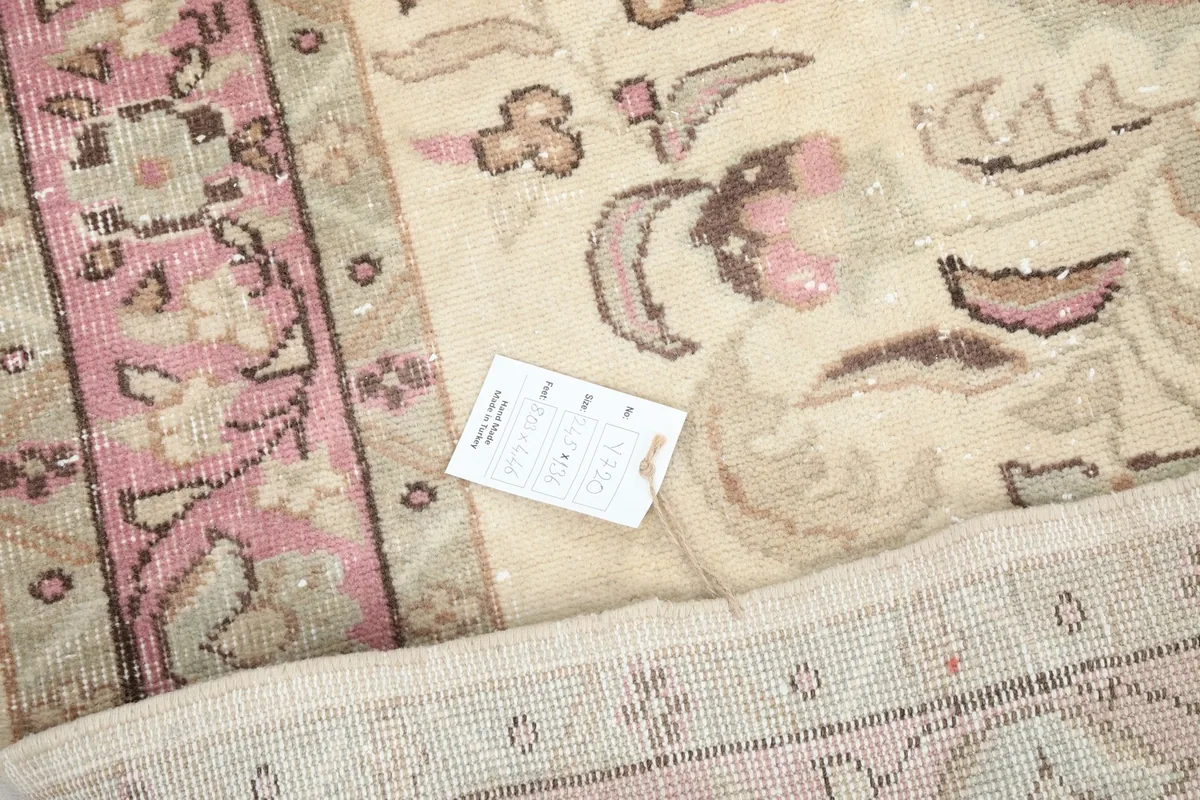 Detail of the rug's low wool pile and the hand-knotted texture