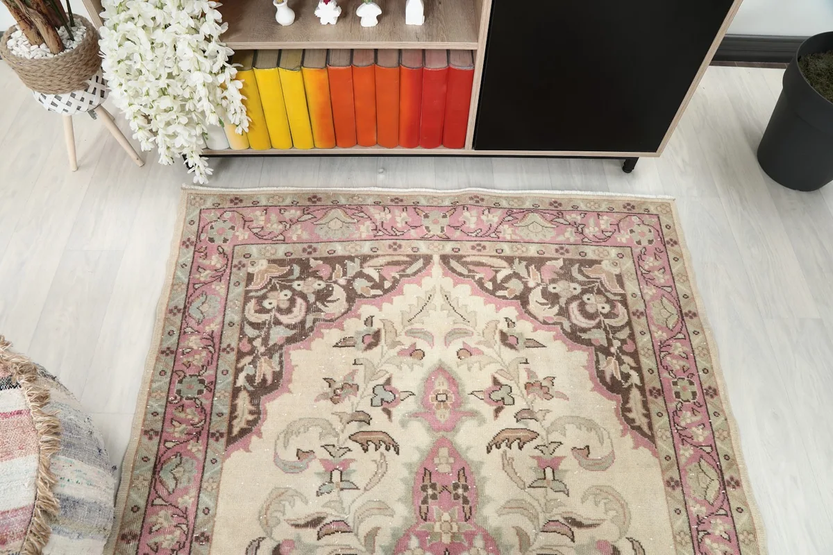 Overhead view focusing on the upper half of the rug, showing the medallion and patterns