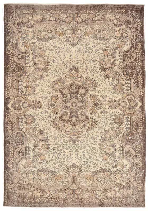Full top view of the 6'0" x 8'5" ivory and brown floral vintage Anatolian rug