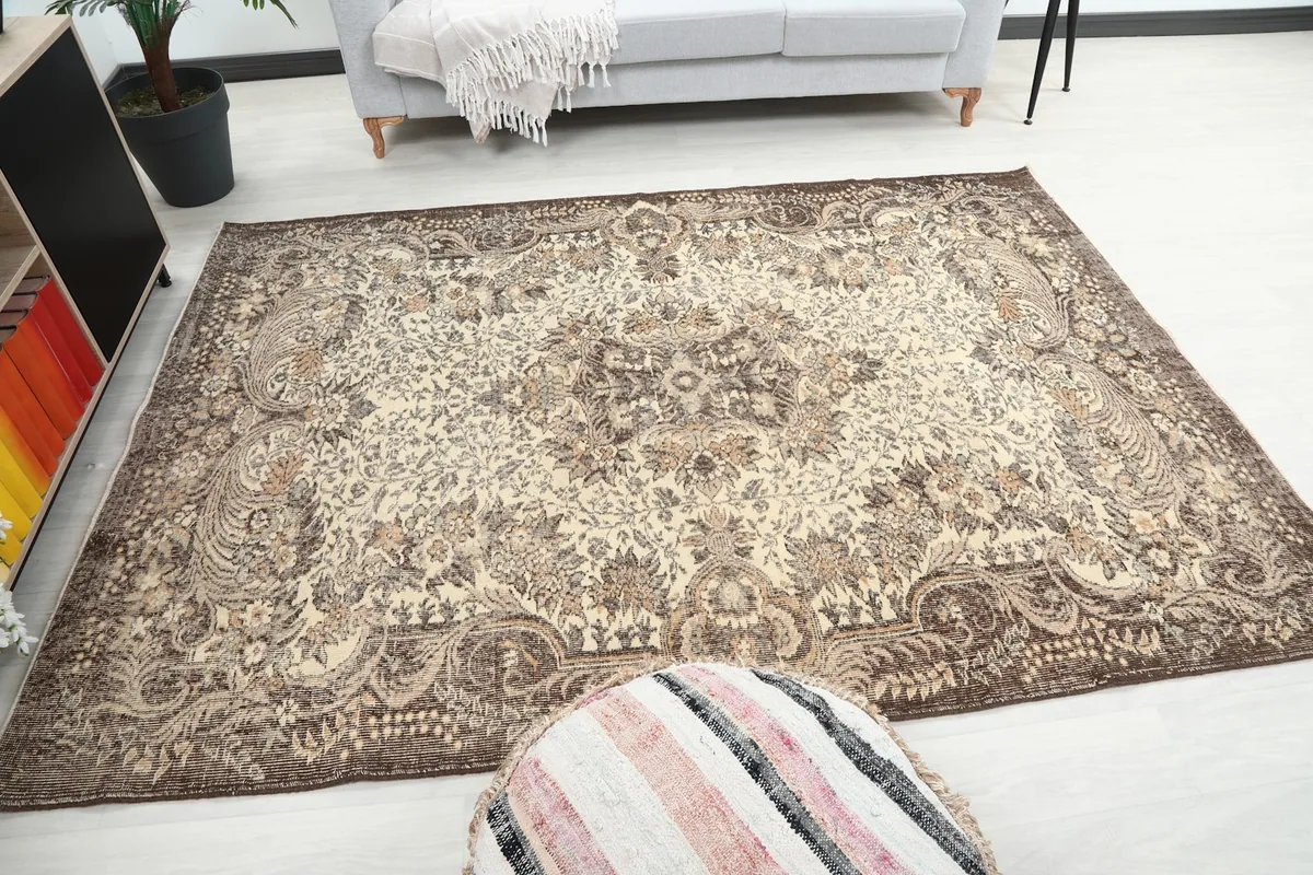 Rug placed in a room, offering a sense of its scale and how it fits a space