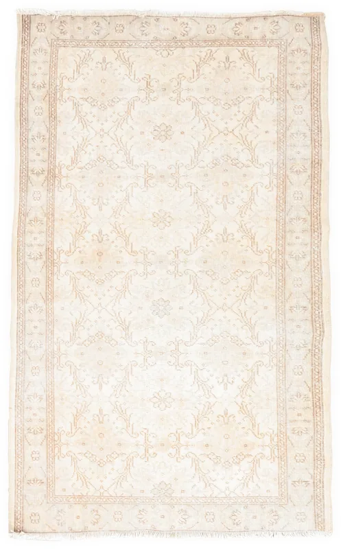 Full top view of the ivory and beige floral vintage Anatolian rug