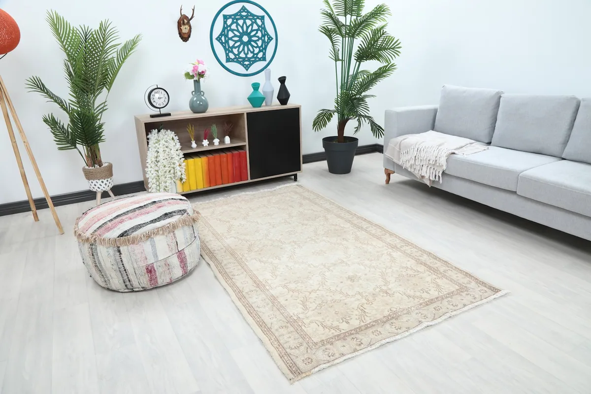 Angle view of the ivory rug in a living room, showing its placement relative to furniture