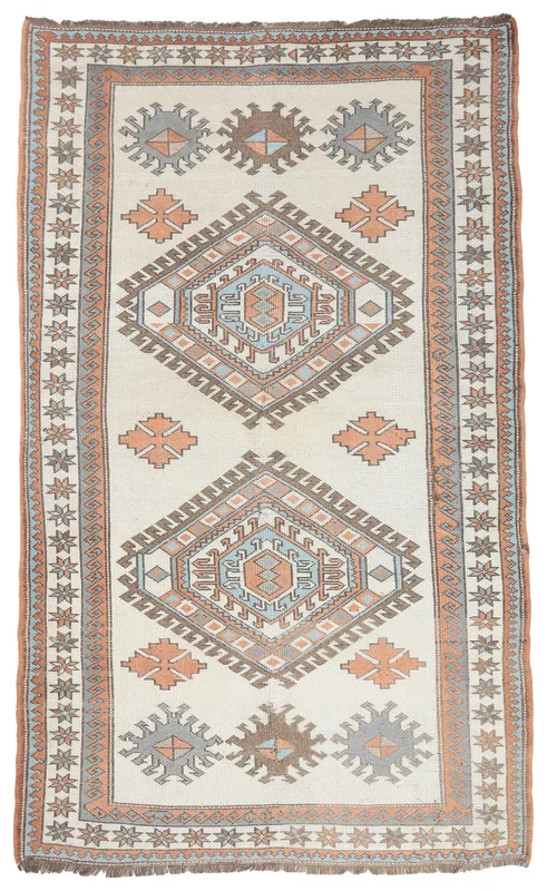 Full overhead view of the 5x8 vintage Anatolian rug with ivory field and geometric patterns.
