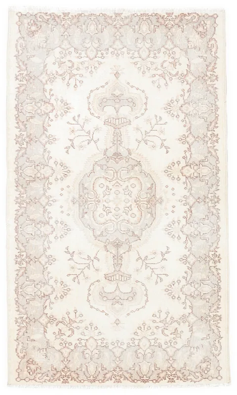 Full overhead view of the ivory and rose vintage Anatolian rug