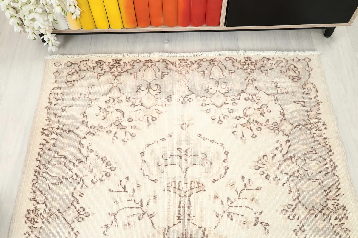 Overhead view of the top half of the rug, highlighting the field and border