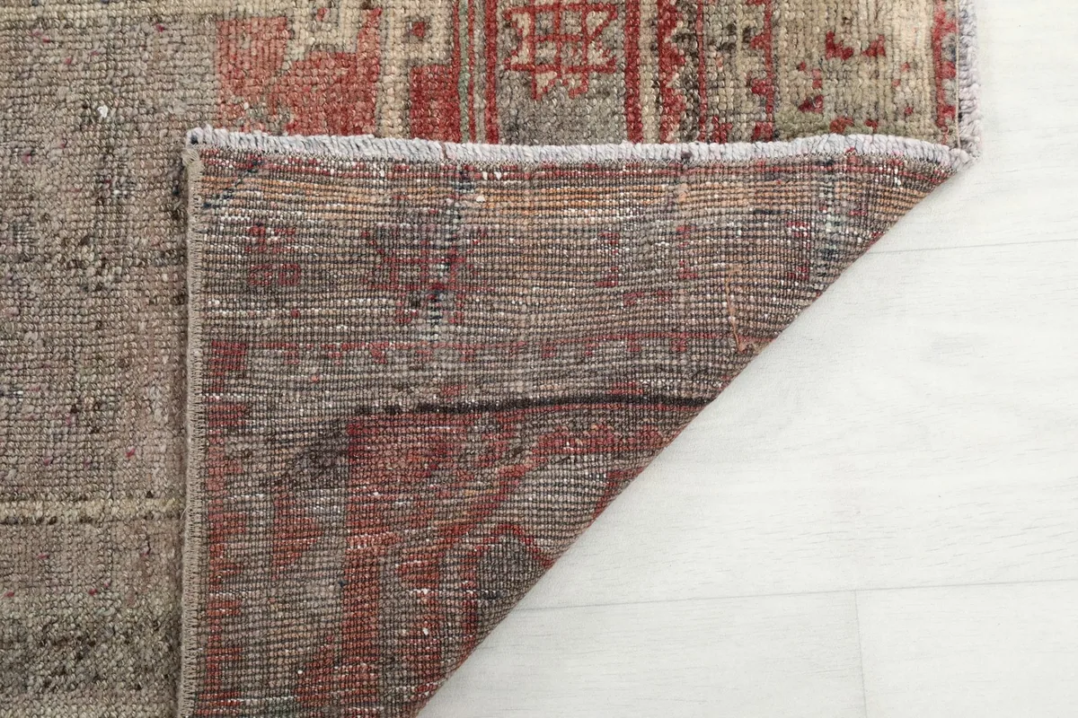 Underside of the hand-knotted rug, revealing the cotton foundation and construction details.