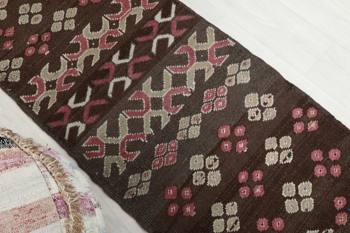 Diagonal view showing a section of the runner with its varied geometric patterns.