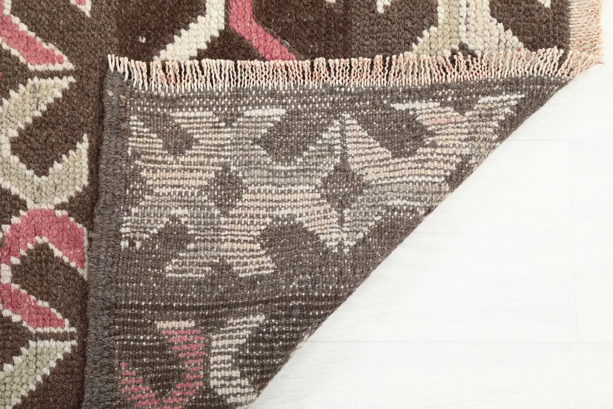 Close-up of the rug's reverse side, showing the intricate hand-knotting and foundation detail.