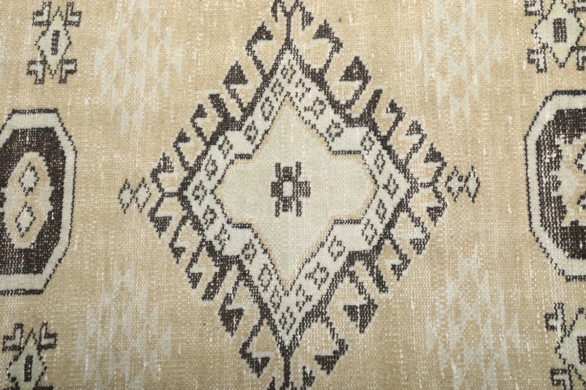 Central detail of the Beige Tribal Geometric Rug, focusing on the main geometric medallion.