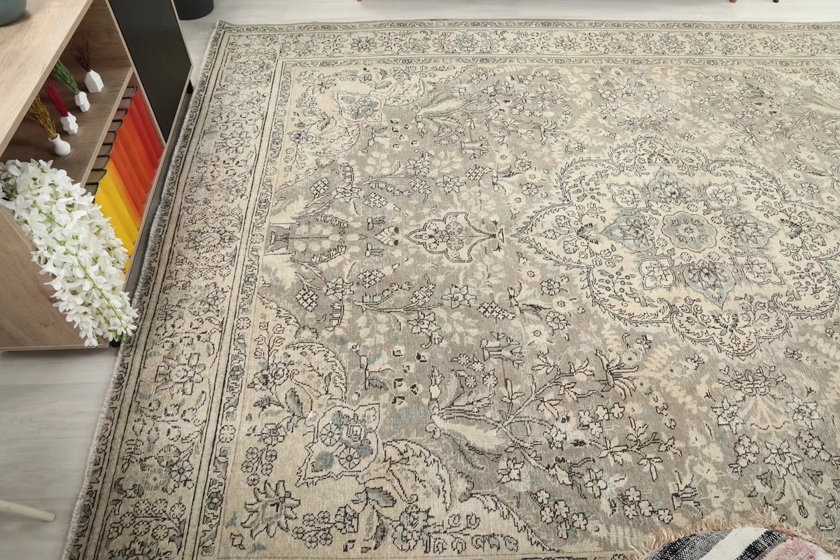 Diagonal view across the rug, revealing the consistent vintage patina and design