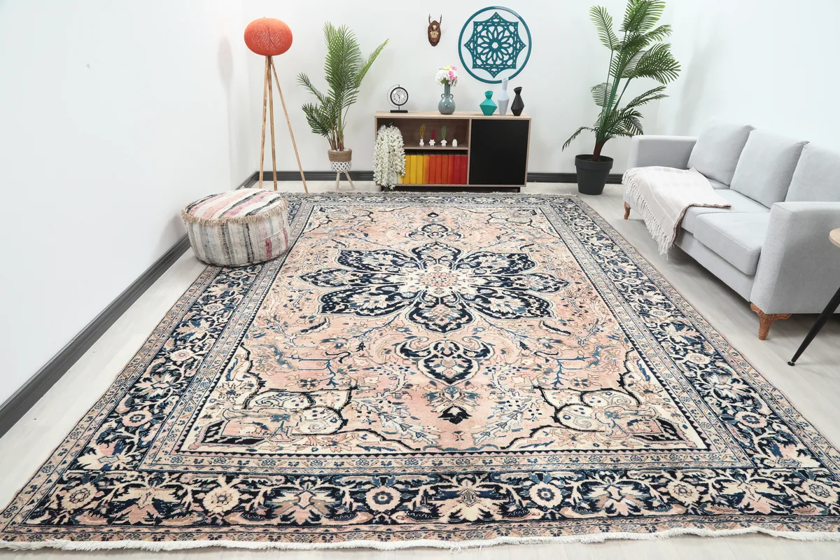 Rose Navy Floral Medallion Rug in a room setting, showcasing its oversized scale and design from an angle.