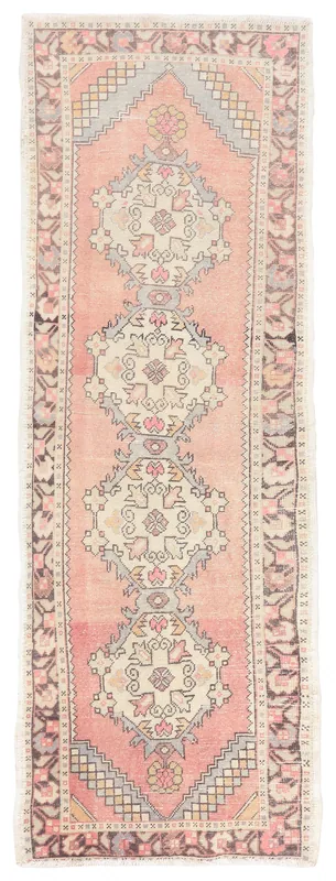 Full top view of the 3x9 rose geometric Anatolian runner rug on a white background