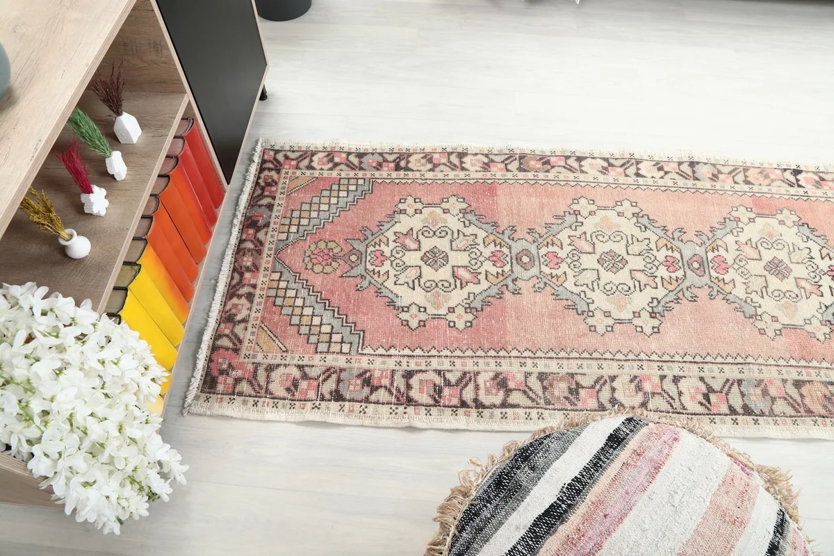 Long view of the runner rug from above, highlighting its elongated shape in a room setting