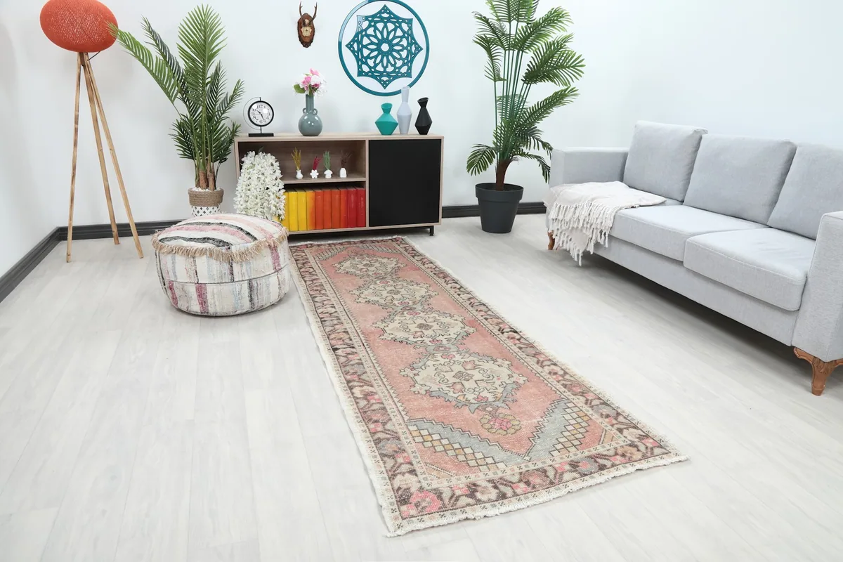 Angle view of the runner rug in a room setting, showcasing its length and colors
