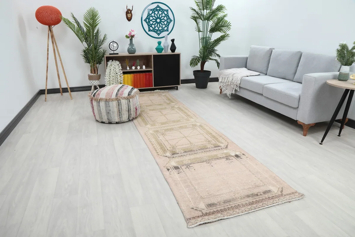 Anatolian runner extending through a hallway, highlighting its long, narrow shape and muted color palette.