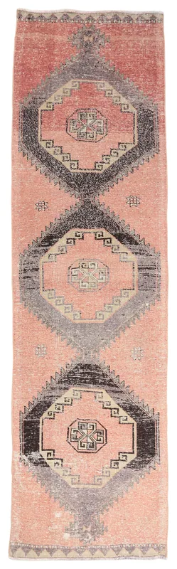 Full overhead view of the 2'11" x 10'11" vintage rose runner rug with geometric patterns