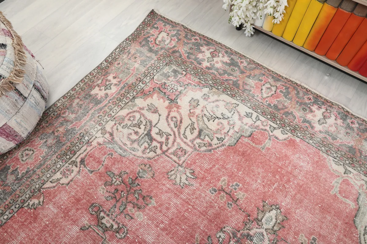 Corner view of the rug showcasing the border and field patterns