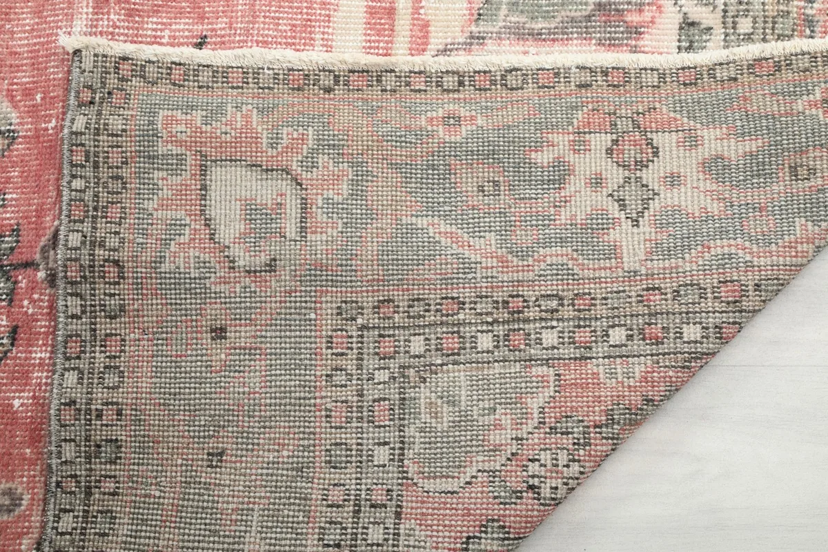Close-up of the hand-knotted cotton foundation on the back of the rug